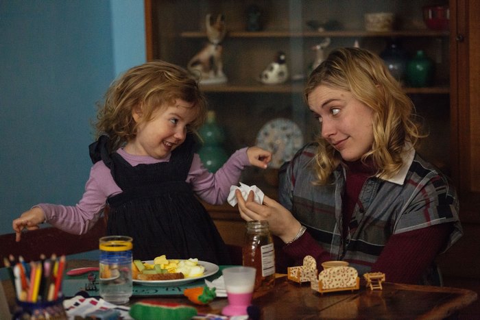 Greta Gerwig with a young girl