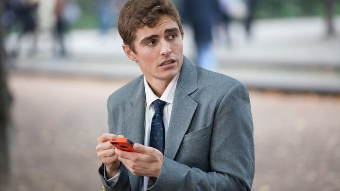 Dave Franco in a Suit Holding a Phone