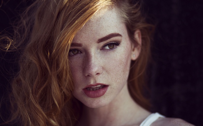 Woman with red hair and freckles