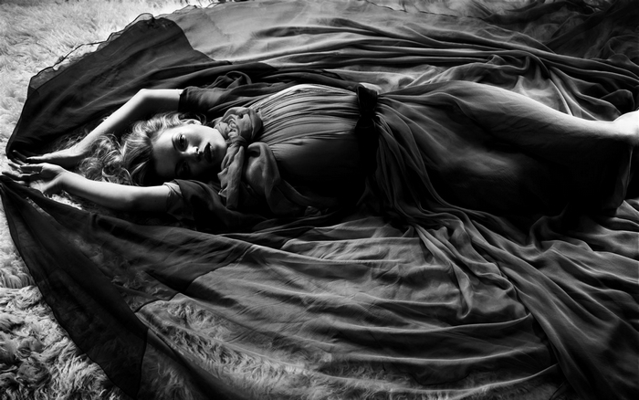 Kate Moss lying on a rug