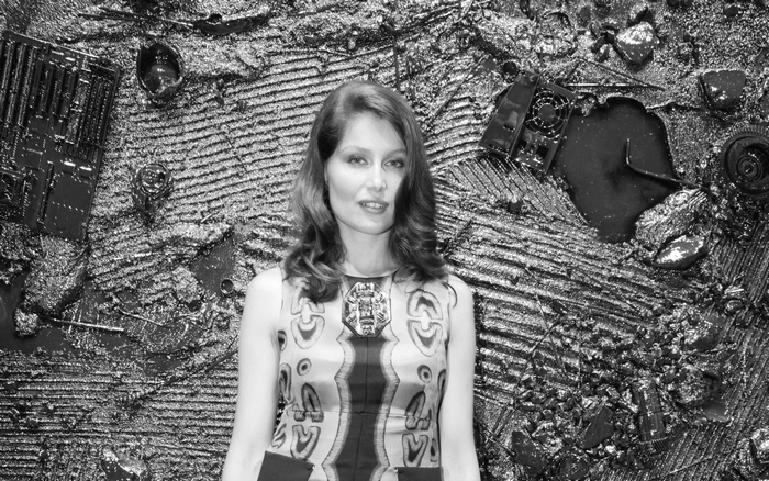 Laetitia Casta in front of abstract art