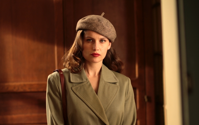Laetitia Casta in a vintage coat and beret
