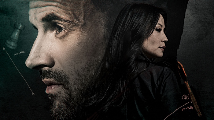 Lucy Liu and a man in a dark setting