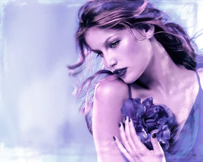 Laetitia Casta with a purple flower