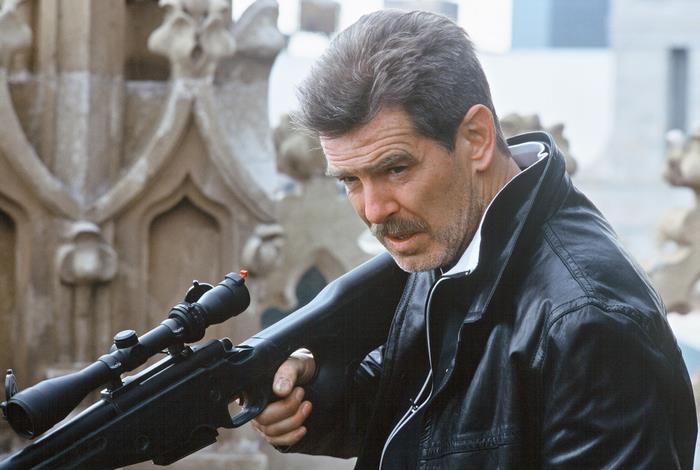 Pierce Brosnan with a sniper rifle