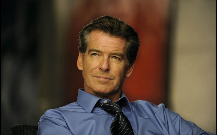 Pierce Brosnan in a blue shirt and tie