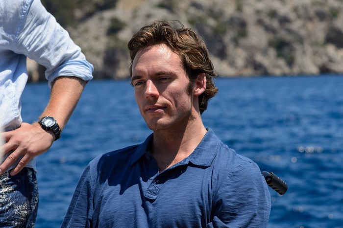 Sam Claflin on a boat
