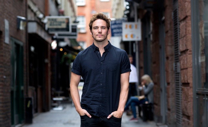 Sam Claflin in an alleyway