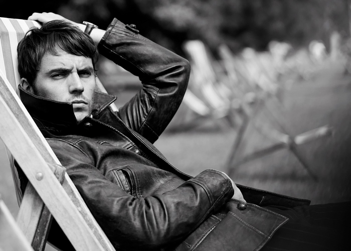 Sam Claflin in a leather jacket