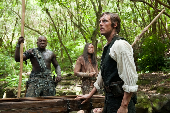 Sam Claflin and companions in a jungle