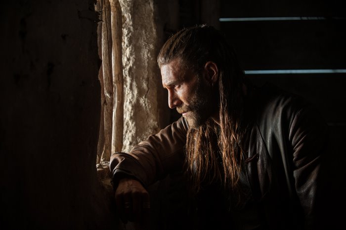 Zach McGowan looking out a window