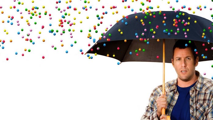 Adam Sandler with umbrella in colorful balls