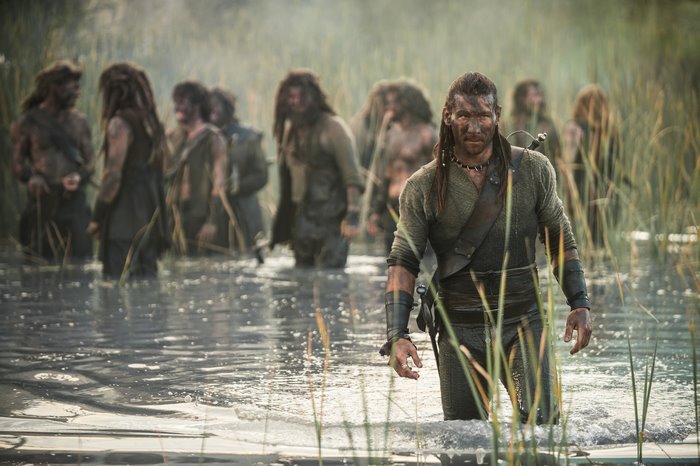 Zach McGowan in water with reeds