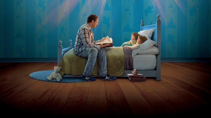 Adam Sandler reading to children in bed