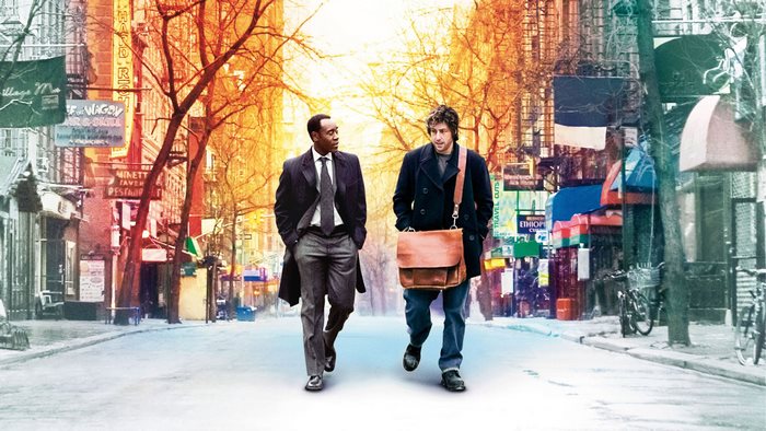Adam Sandler and Don Cheadle walking down a street