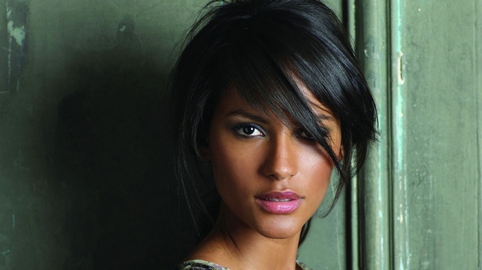 Woman with dark hair and makeup