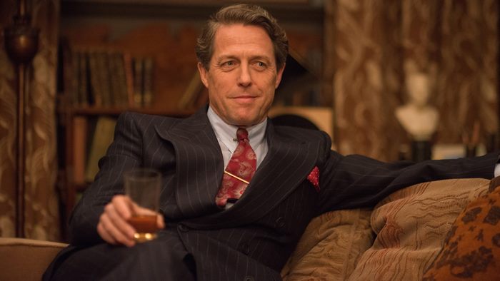 Hugh Grant in a pinstripe suit