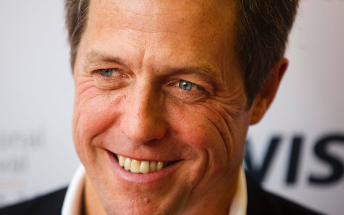 Hugh Grant smiling
