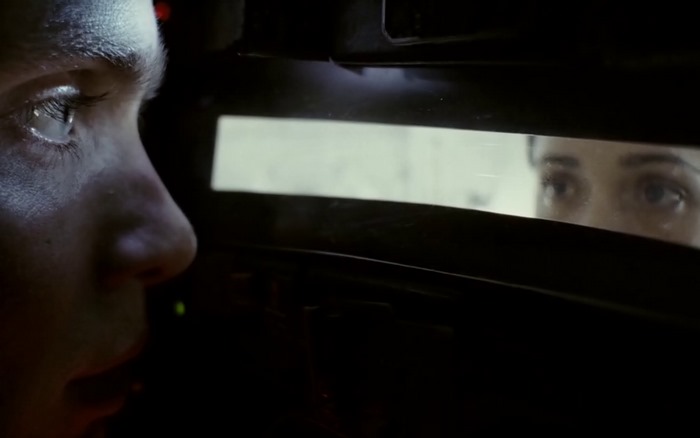 Cillian Murphy looking through a window