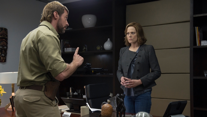 Sigourney Weaver and Hugh Jackman in an office