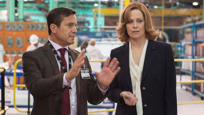Sigourney Weaver and man in factory