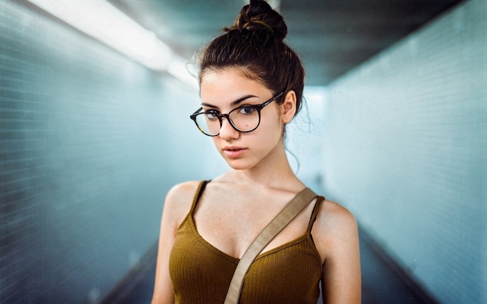 Young woman with glasses in a tunnel