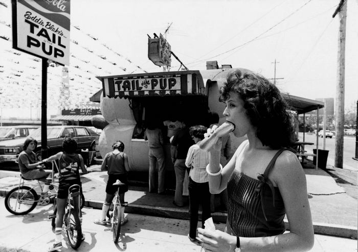 Sigourney Weaver eating a hot dog at Tail Pup