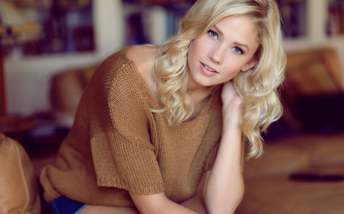 Blonde woman in a brown sweater