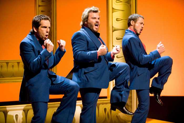 Jack Black, Ben Stiller, and Seth Rogen in blue suits