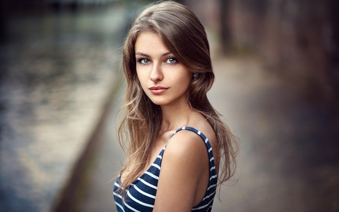 Woman with blue and white striped top