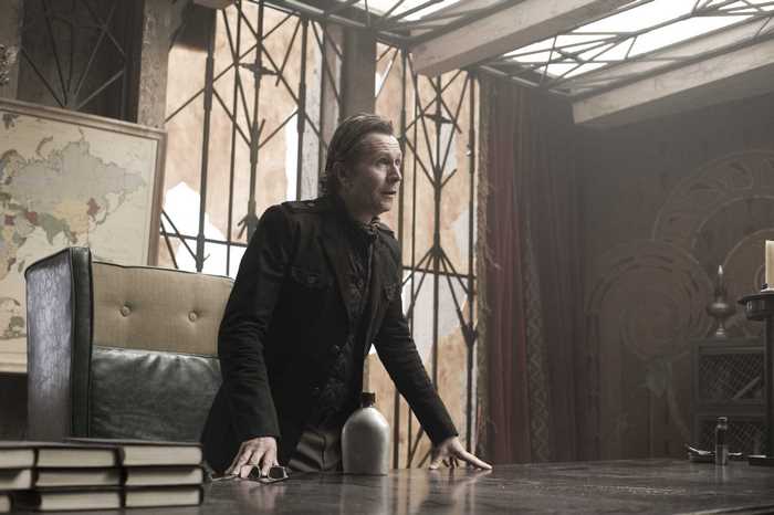 Gary Oldman in a dark room