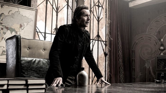 Gary Oldman in a dimly lit room