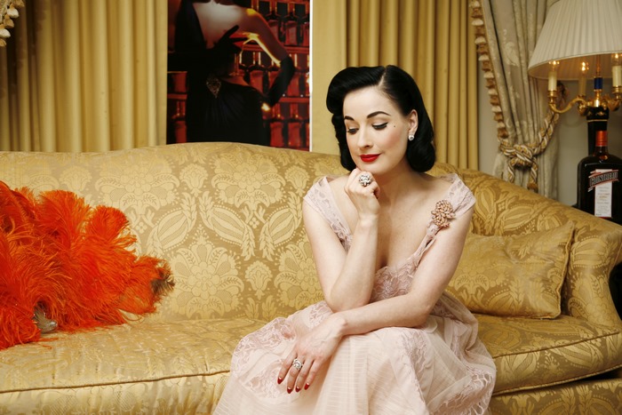 Dita Von Teese on a couch