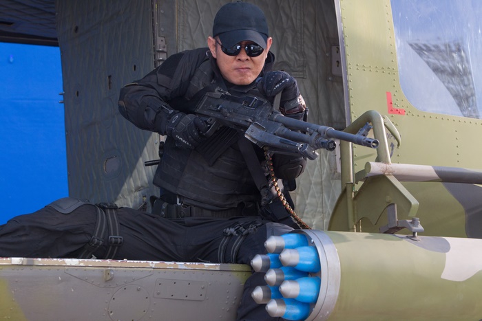 Jet Li with a machine gun on a helicopter