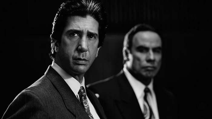David Schwimmer and John Travolta in a black and white portrait