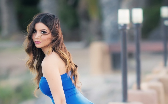 Woman in blue dress outdoors