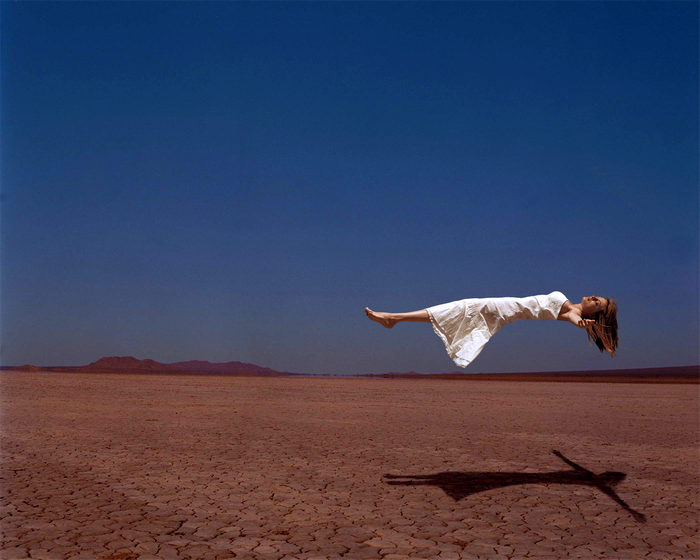 Heather Graham levitating in a desert
