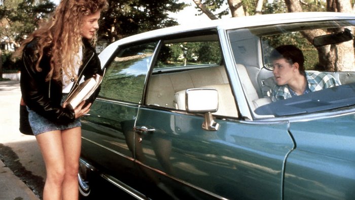 Heather Graham and a boy in a car