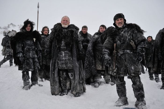 Group of men in fur-lined armor in the snow