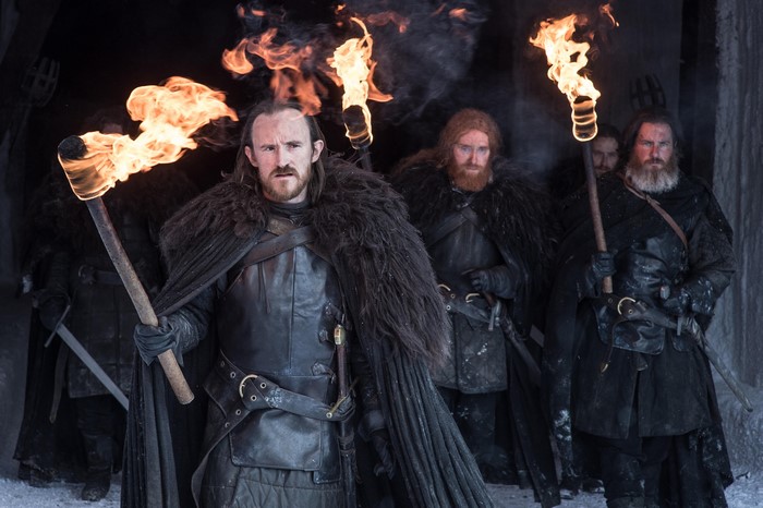 Ben Crompton and men holding torches