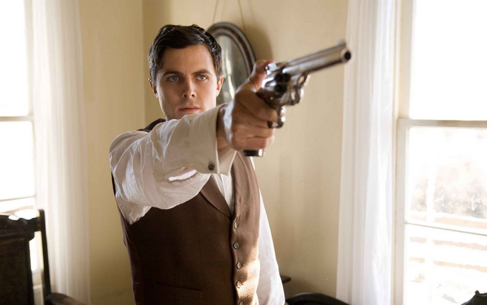 Casey Affleck holding a gun