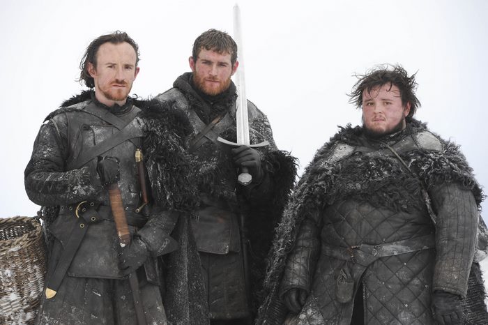 Three men in furs and armor in the snow