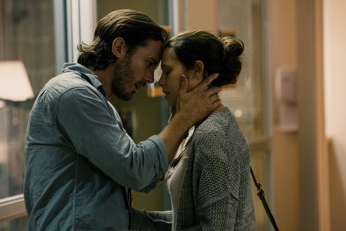 Casey Affleck and woman in intimate moment