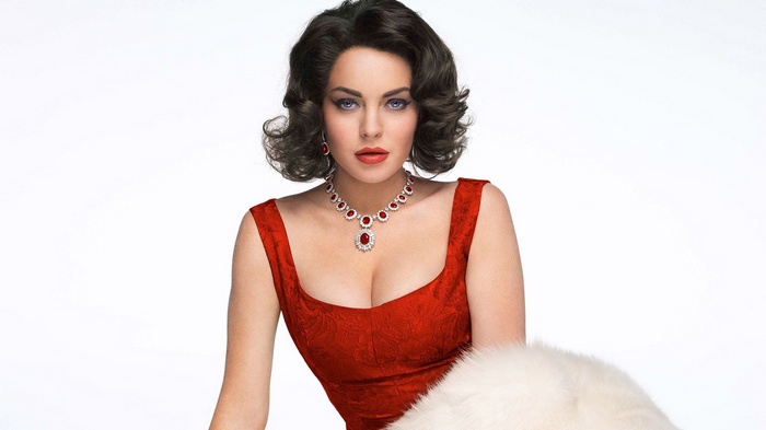 Woman in red dress with ruby necklace