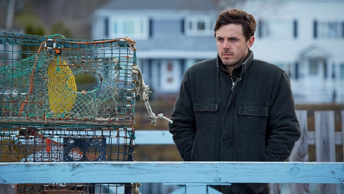 Casey Affleck standing by lobster traps