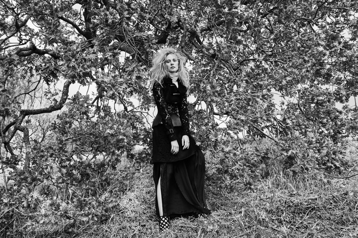 Deborah Ann Woll in a black dress outdoors