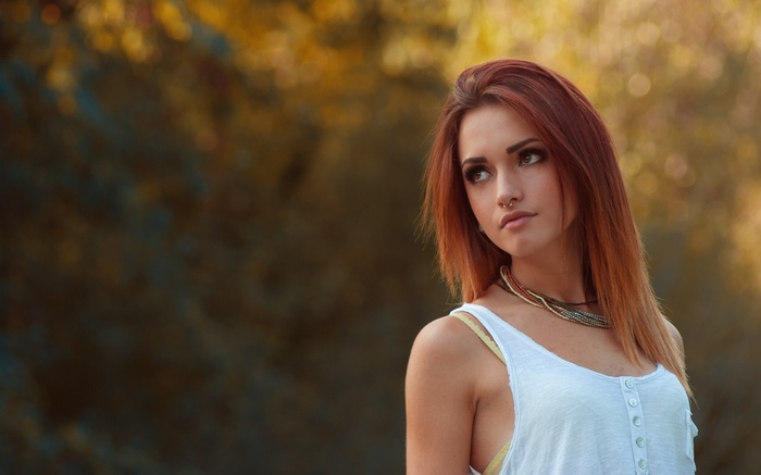 Woman with red hair and nose ring