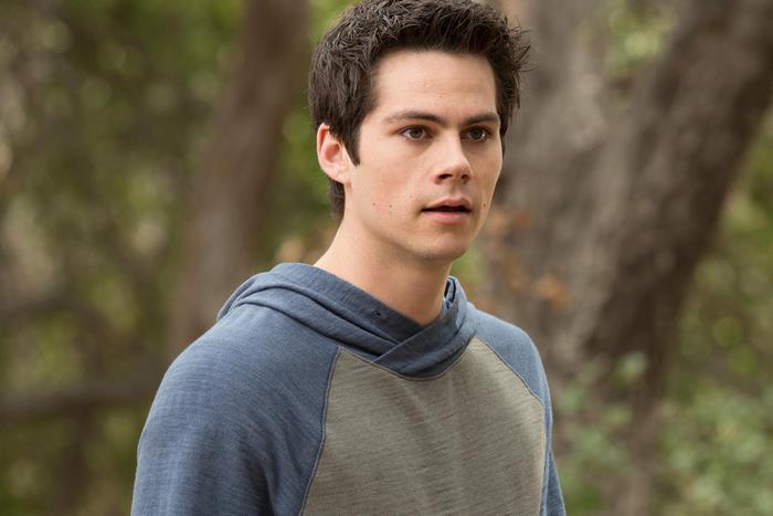 Dylan O'Brien in a blue and green hoodie