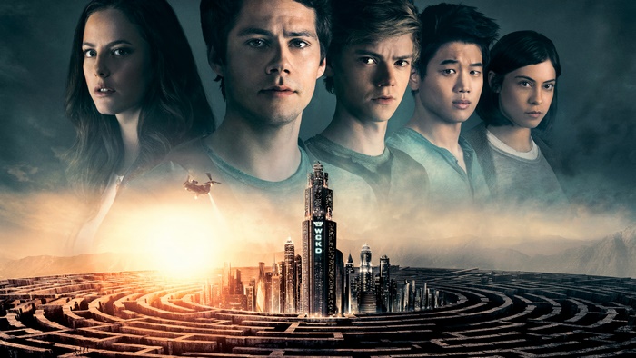 The Maze Runner cast with WCKD tower and maze