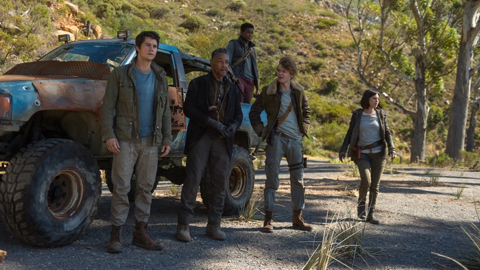 Dylan O'Brien and group with vehicle